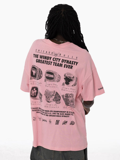 Back view of Bulls Dynasty Pink Tee featuring an oversized fit, bold text design, and championship rings on back.