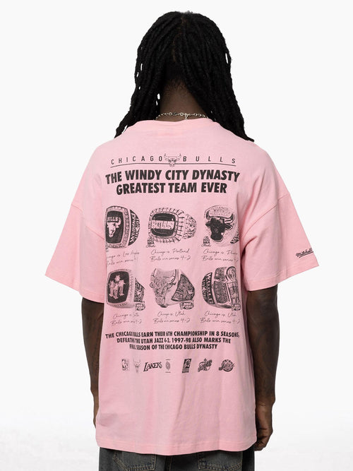 Back view of Bulls Dynasty Pink Tee featuring an oversized fit, bold text design, and championship rings on back.
