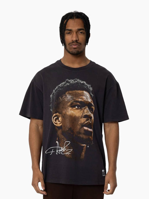 Giannis Antetokounmpo Big Head Tee in vintage black featuring oversized player portrait and signature on front.